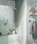 Brushed Nickel Extended 12-Inch Straight Overhead Shower Arm With 1/2 IPS Connections in modern bathroom setup