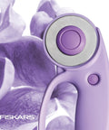 Top Tier Loop Handle Rotary Cutter For Heavy Duty Fabric And Vinyl Crafting Precision Ground Steel Blade Insanely Sharp close-up of purple handle