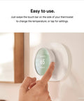 Person adjusting Nest Thermostat Smart Programmable WiFi Thermostat With Energy Star Certification for easy home automation.