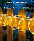 2 Pack Solar Rope Lights 78Ft Total 200LED Warm White Outdoor String Lights IP65 Waterproof displayed on wooden fence