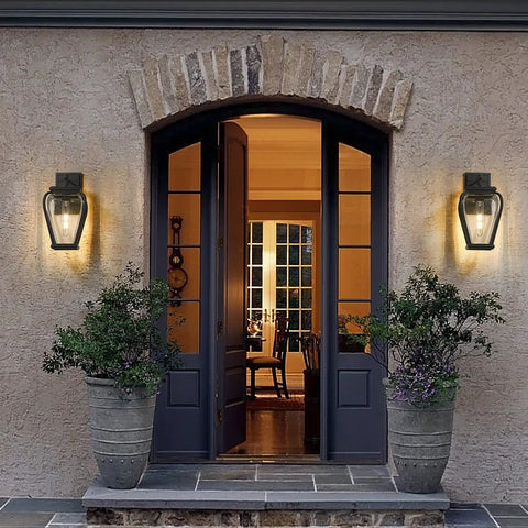 House entrance with two Heavy Duty Aluminum Outdoor Wall Light Fixture Built Tough With Waterproof Lanterns on either side of the door.