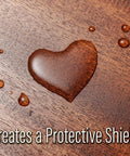 Heart-shaped polish on wood surface illustrating "Light Wood Scratch Cover And Polish Pack Of 2 For A Slick Easy Shine That Cleans Conditions Protects And Brings Out Natural Wood Beauty For Everyday Scratches And Wear."