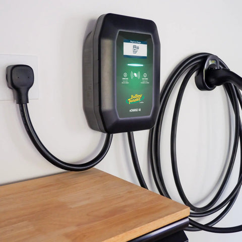 48 Amp Level 2 Wall Mounted Indoor Outdoor Fast Electric Vehicle Charging Station With 25Ft Flexible Cable Nema 14-50 Connector on a wall.