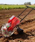 Do It All Garden Seeder With Clear Seed Box And Adjustable Spacing For Corn Peanuts Soybeans And Fertilizer Spreader in field