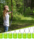 Person aiming a bow at Slingshot Target Bells Set 10 Pieces Loud Bangin Bell Feedback Targets with pro-grade stainless steel.