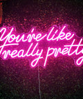 You Are Like Really Pretty Neon Lights Sign for Wall Decor Bar Salon Home Shop and Party Large Dimmable Pink Neon LED Sign Perfect for Wedding and Birthday Vibe and Insta Ready Rooms, glowing on a dark background.