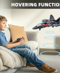 Boy playing with Foam RC Airplane For Kids And Adults, Two Point Four GHz Remote Control Plane With Colorful Lights, hovering indoors