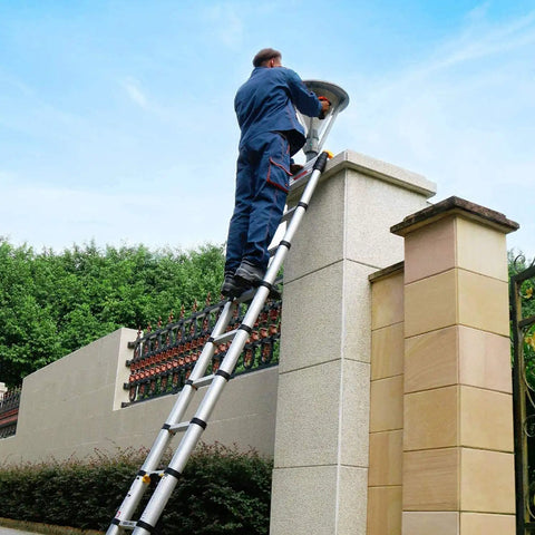 Man using 10.5 Ft Telescoping Aluminum Ladder With 11 Steps Heavy Duty Extension Ladder for home roof maintenance
