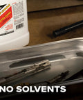 One Gallon Professional Workhorse Ultrasonic Cleaner Fluid Nukes Stubborn Cosmoline Carbon Buildup And Heavy Grease Residue Quickly Wiping Dirtiest Metal Parts Spotless in a cleaning tank with metal parts.