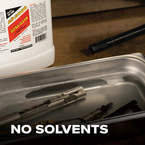 One Gallon Professional Workhorse Ultrasonic Cleaner Fluid Nukes Stubborn Cosmoline Carbon Buildup And Heavy Grease Residue Quickly Wiping Dirtiest Metal Parts Spotless in a cleaning tank with metal parts.
