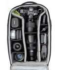 Interior of Walker Pro Rolling Camera Backpack with customizable compartments showing camera gear and lenses