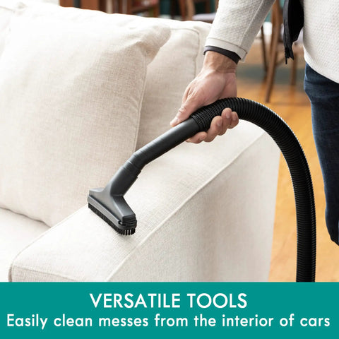 Wet Dry Canister Vacuum Cleaner 3.2 Gallon With 2.5 Peak HP Motor cleaning a sofa, showcasing versatile tool use.