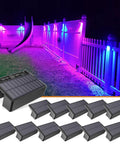 Outdoor Solar Fence Lights 12 Pack With 1800mAh Battery Waterproof LED Color Glow illuminating a fence with multicolor glow.