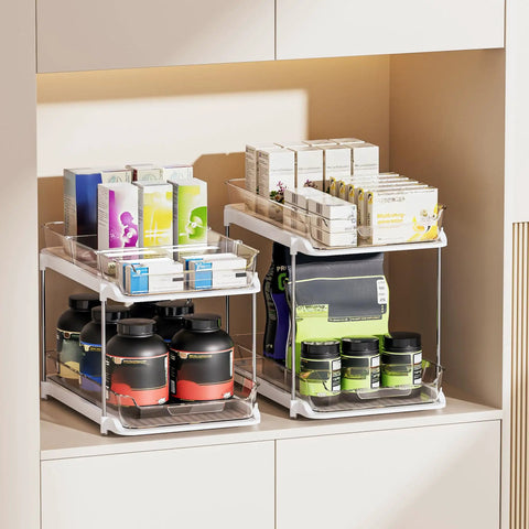 Super Handy Two Tier Under Sink Organizers And Bathroom Storage Solutions For Cabinets And Kitchen Pantries With Smooth Slide Out Drawers And Fully Adjustable Dividers In Bright White Two Pack with various jars and boxes.