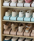 Double Deck Vertical Shoe Slot Organizer With Adjustable Two Tier Design Optimized To Claim Prime Floor Space And Keep Your Daily Kicks Stacked Tight Without Extra Closet Clutter showing stacked shoes on multi-color slots in wooden shelf.