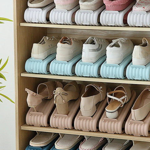 Double Deck Vertical Shoe Slot Organizer With Adjustable Two Tier Design Optimized To Claim Prime Floor Space And Keep Your Daily Kicks Stacked Tight Without Extra Closet Clutter showing stacked shoes on multi-color slots in wooden shelf.