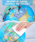 8 Inch Blue World Globe With Stainless Steel Stand being cleaned, showcasing its washable and erasable HD coating design.
