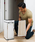 Man installing MA 40 Replacement Filter For Allergens Smoke Wildfire Smoke Dust Odors Pollen And Pet Dander 3 In 1 With Pre Filter