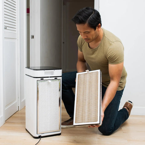 Man installing MA 40 Replacement Filter For Allergens Smoke Wildfire Smoke Dust Odors Pollen And Pet Dander 3 In 1 With Pre Filter