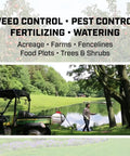 Person using Made In USA 25 Gallon ATV UTV Sprayer With 12 Volt Power for lawn care near a lake.