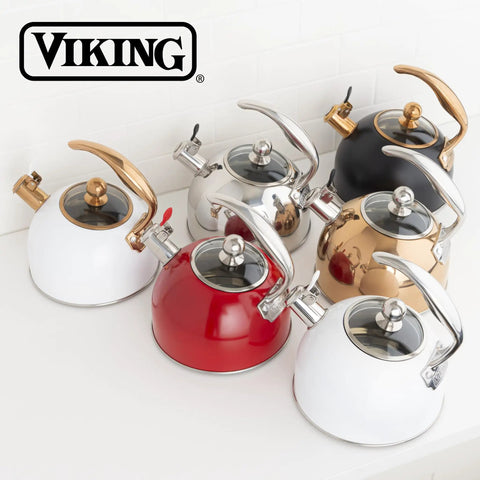Collection of stovetop tea kettles with ergonomic handles and tempered glass lids in various colors, including red and white.
