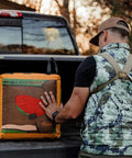 Person loading Four Sided Archery Target Bag For Backyard Practice And Outdoor Training Double Duty Field Point Target into truck