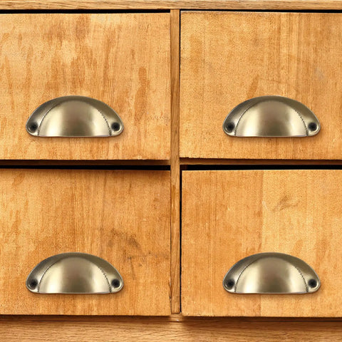 Close-up of wooden drawers with ten piece set antique style iron cabinet handles cup pulls 81 by 35 millimeter rustic drawer pulls.