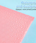Close-up of waterproof pink mailer from 200-Count 4x6 Inch Bubble Mailers Waterproof Padded Envelopes Self Adhesive Poly Bubble Packaging Bulk Shipping