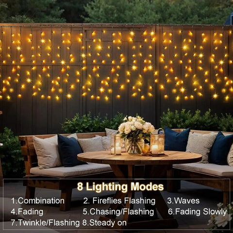 Solar Curtain Lights Outdoor 200 LED Set, 13Ft by 3.3Ft warm white glow on garden fence for soft outdoor ambiance