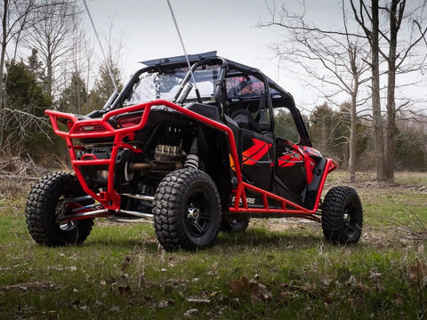 Beefed Up Billet Aluminum Rear Radius Arms For Polaris RZR XP 1000 And XP 4 1000 Models, 1-1/4 Inch 7075 Solid Aluminum Bar Upgrade Over OEM 3/4 Inch, Heavy Duty Strength, Precise Fit, Not Compatible With Polaris Rear Bumpers. Red Polaris RZR XP 1000 rear radius arms on off-road UTV