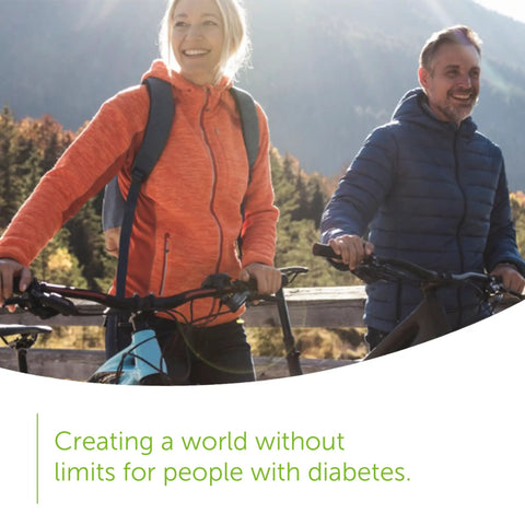 Two people biking outdoors, representing active lifestyle for diabetes management, text reads 'Creating a world without limits for people with diabetes.'