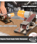 7 Speed Adjustable Electric Belt Sander Machine 15 Degree Bench Grinder with Forward Reverse Switch Copper Motor for Metalwood Deburling Polishing and DIY Crafts Heavy Duty Grinding Tool on a workbench.