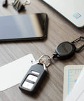 Sidekick ID Badge And Key Reel With 24 Inch Kevlar Cord on desk with key and ID card