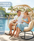 Couple seated in Double Wicker Egg Chair Rocker For Indoor Or Outdoor Patio Cozy Two Person Lounge With Thick Cushions