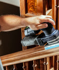 Person sanding stair banister with Granat Profile Soft Sanding Sheets 80 By 133 Millimeter, 10 Pack, Flexible Foam Backing
