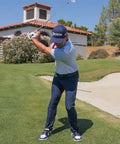 Golfer using Patented Golf Swing Training Ball That Helps You Sync Arms And Body For Real Connection From Takeaway Through Follow Through.