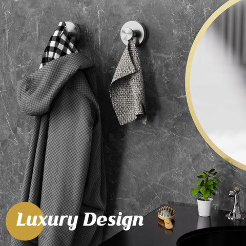 Removable Suction Cup Hooks For Shower And Bathroom Wall holding towels and robes on a tiled surface.