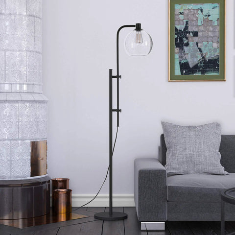 Height Adjustable Floor Lamp With Seeded Globe Glass Shade In Blackened Bronze Finish in living room setting