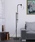 Height Adjustable Floor Lamp With Glass Milk Shade In Brass Finish Modern Go To Globe Style Lighting 68 Inches Tall E26 Base 8 Ft Cord Bulb Friendly For Incandescent LED CFL For Any Room Use standing beside a sofa in a modern living room setting.
