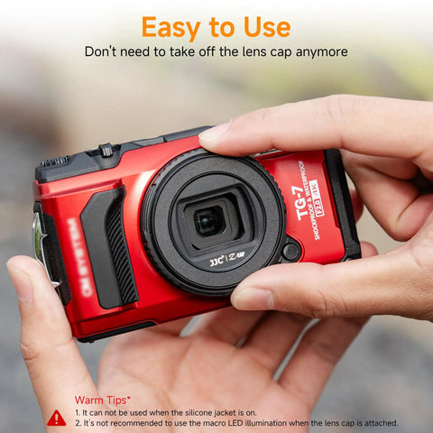 Person holding Olympus TG-7 camera with Waterproof Lens Cap Cover Protector For Olympus Tough TG Series Cameras TG-7 Rotate To Open Or Close