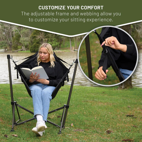 Person sitting in Portable Hammock Camping Chair With Stand by a lake, showing adjustable straps, suitable for outdoor use