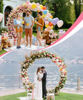 Massive Metal Garden Arch Trellis For Weddings And Parties 8 By 7 Feet Heavy Duty Arch Frame adorned with balloons and flowers.