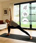 Woman doing yoga indoors with Portable Copper Grounding Rod Kit, showing 40 ft reach and benefits like lightweight and easy use.