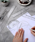 Real Deal 7 Piece Geometry Set With Fine Tip Drawing Compass And 6 Plus 4 Inch Protractors Clear Triangle And Straight Ruler Smooth Drafting Gear For Back To School And Office on a desk.