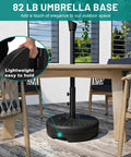 Beefed Up Heavy Duty Outdoor Umbrella Base For Market Umbrellas, 81.5 Lb Capacity Water Filled Base in black on patio