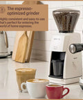 Premium Black Conical Burr Coffee Grinder Crafted For On Point Espresso Pulls Featuring Slick Micro Dial Controls A Top Shelf Build That Always Delivers The Goods For Real Coffee Heads with coffee cups on kitchen counter.
