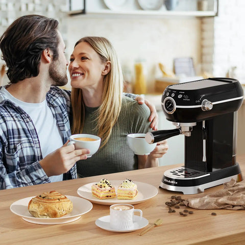 Couple enjoying coffee with the Pro Espresso Maker With Auto Milk Frother on the table next to pastries and latte art.