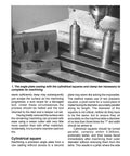 Book: Milling for Home Machinists; photo of angle plate, clamp bar and cylindrical squares on a milling table.