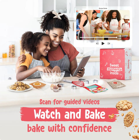 Mother and daughter using 6 Month Kids Baking Subscription Kit With Pre Measured Ingredients and Bake Along Videos in kitchen.
