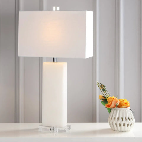 White Alabaster 27 Inch Rectangular Table Lamp With White Linen Shade on table beside vase with flowers